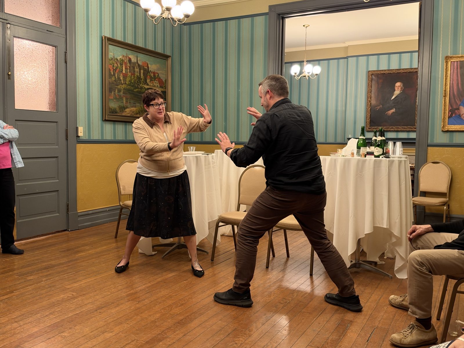 Two participants performing an improv exercise at The Athenæum