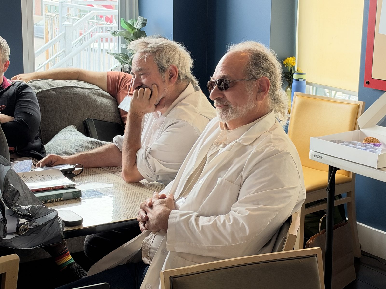 Two attendees listening to a session